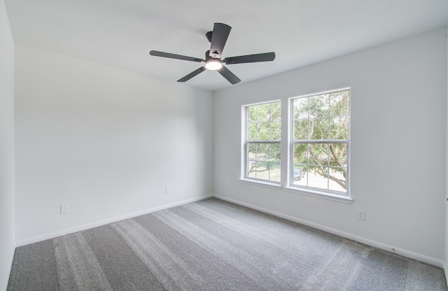 24206 Moon Ridge Ct, Katy, TX 77494 - spare room featuring carpet flooring, baseboards, and a ceiling fan
