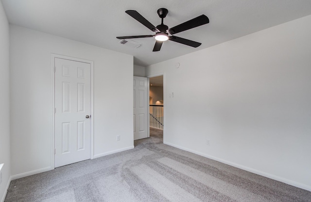 24206 Moon Ridge Ct, Katy, TX 77494 - unfurnished bedroom featuring carpet floors, baseboards, and ceiling fan