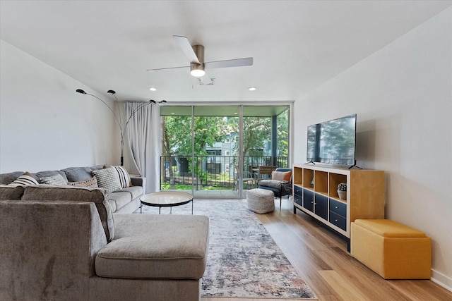 12500 Melville Dr Unit 218B, Montgomery, TX 77356 - living room with expansive windows, light wood-style flooring, a ceiling fan, and recessed lighting