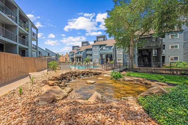 12500 Melville Dr Unit 218B, Montgomery, TX 77356 - view of yard featuring a residential view and a community pool