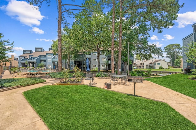 12500 Melville Dr Unit 218B, Montgomery, TX 77356 - view of property's community with a residential view and a lawn