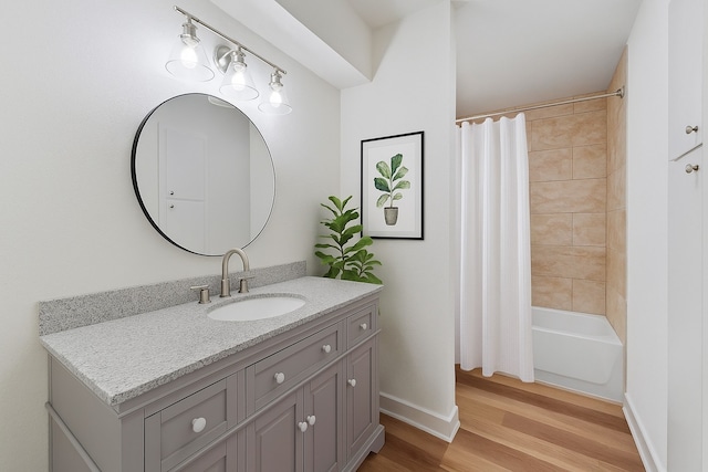 12500 Melville Dr Unit 218B, Montgomery, TX 77356 - full bath with vanity, wood finished floors, shower / bath combo, and baseboards
