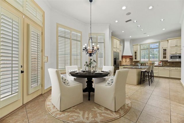 16610 Champagne Falls Ct, Spring, TX 77379 - dining room with light tile patterned flooring, a chandelier, recessed lighting, and crown molding