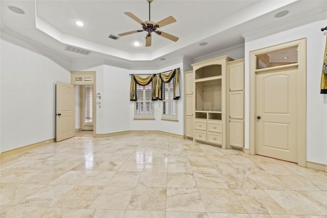 16610 Champagne Falls Ct, Spring, TX 77379 - unfurnished bedroom featuring baseboards, a raised ceiling, recessed lighting, ceiling fan, and light marble finish flooring