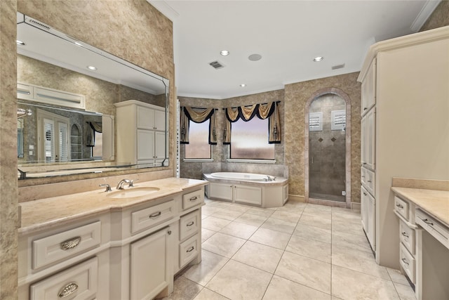16610 Champagne Falls Ct, Spring, TX 77379 - bathroom with vanity, a stall shower, a garden tub, tile patterned flooring, and ornamental molding