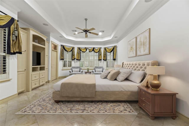 16610 Champagne Falls Ct, Spring, TX 77379 - bedroom featuring a tray ceiling, baseboards, and a ceiling fan