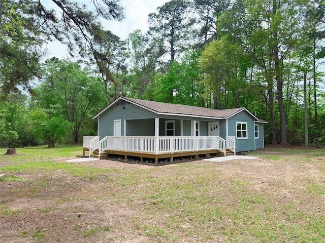 2100 Lilley Yeager Loop S, Cleveland, TX 77328 - view of front of property featuring a porch and a shingled roof