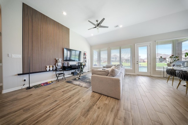 24103 Corinaldo Ct, Katy, TX 77493 - living room with wood finished floors, ceiling fan, high vaulted ceiling, baseboards, and recessed lighting