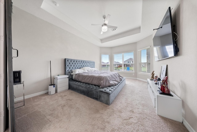 24103 Corinaldo Ct, Katy, TX 77493 - bedroom featuring a tray ceiling, baseboards, and carpet floors