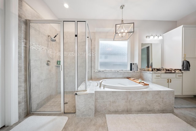 24103 Corinaldo Ct, Katy, TX 77493 - bathroom featuring a bath, a shower stall, vanity, tile patterned floors, and a chandelier