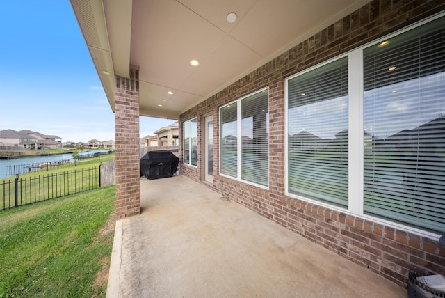 24103 Corinaldo Ct, Katy, TX 77493 - view of patio / terrace featuring a water view, grilling area, and a residential view