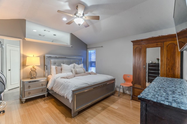 14811 S Bristol Harbour Cir, Houston, TX 77084 - bedroom with lofted ceiling, light wood-style flooring, ceiling fan, and baseboards