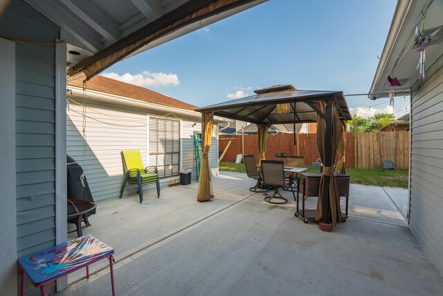 14811 S Bristol Harbour Cir, Houston, TX 77084 - fenced backyard with outdoor dining space, a gazebo, and a patio area