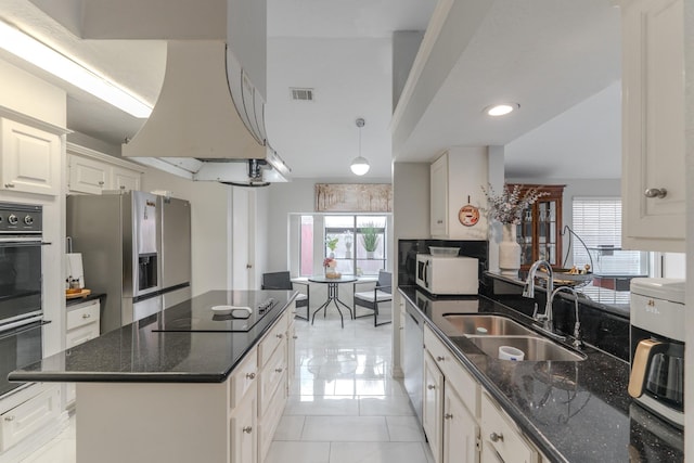 14811 S Bristol Harbour Cir, Houston, TX 77084 - kitchen featuring a sink, black appliances, dark stone counters, white cabinets, and light tile patterned floors