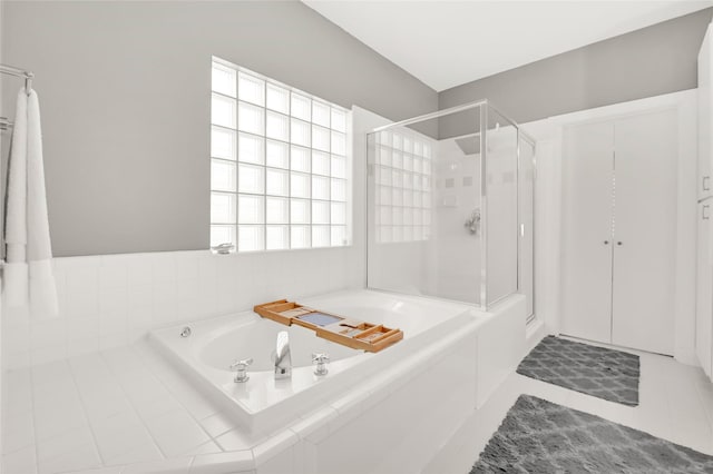 914 W 25th St Unit 2, Houston, TX 77008 - bathroom with a stall shower, a garden tub, and tile patterned flooring