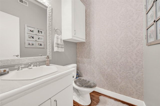 914 W 25th St Unit 2, Houston, TX 77008 - bathroom featuring toilet, vanity, wood finished floors, baseboards, and curtained shower