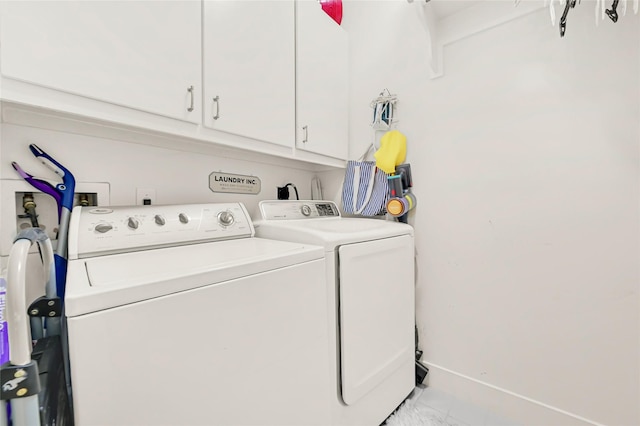 914 W 25th St Unit 2, Houston, TX 77008 - washroom with washer and dryer, cabinet space, marble finish floors, and baseboards