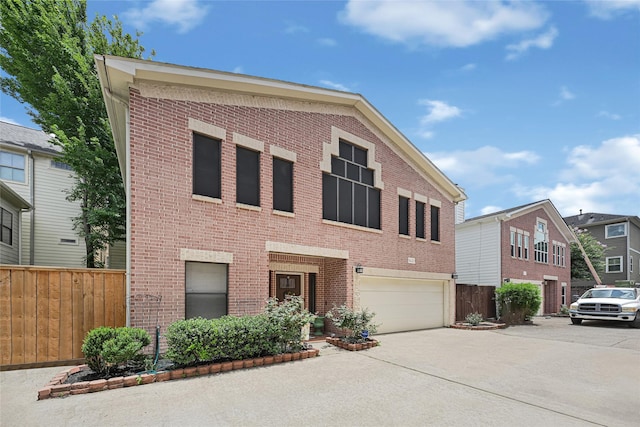 914 W 25th St Unit 2, Houston, TX 77008 - view of front of home featuring brick siding, an attached garage, and concrete driveway