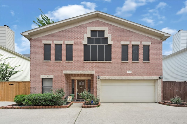 914 W 25th St Unit 2, Houston, TX 77008 - view of front of home with brick siding, concrete driveway, and a garage