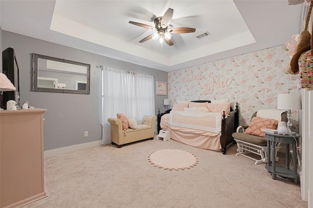 914 W 25th St Unit 2, Houston, TX 77008 - carpeted bedroom with a raised ceiling, baseboards, and a ceiling fan