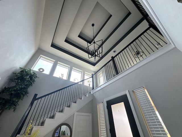 31414 Golden Cliffs Ln, Fulshear, TX 77441 - staircase with a towering ceiling and a chandelier