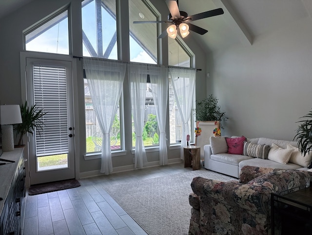 31414 Golden Cliffs Ln, Fulshear, TX 77441 - living area featuring ceiling fan, plenty of natural light, wood finished floors, high vaulted ceiling, and beamed ceiling