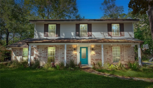 676 Ravensworth Dr, Conroe, TX 77302 - view of front facade featuring brick siding, a front yard, and a shingled roof