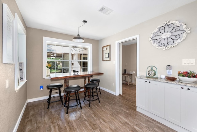 676 Ravensworth Dr, Conroe, TX 77302 - dining space featuring wood finished floors and baseboards