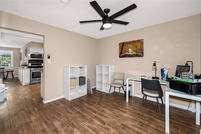 676 Ravensworth Dr, Conroe, TX 77302 - home office featuring dark wood finished floors, ceiling fan, and baseboards