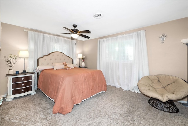 676 Ravensworth Dr, Conroe, TX 77302 - bedroom featuring carpet floors, multiple windows, and ceiling fan
