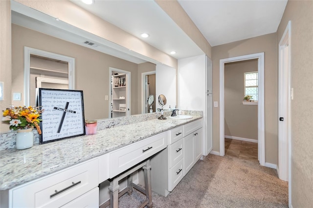 676 Ravensworth Dr, Conroe, TX 77302 - bathroom featuring vanity, baseboards, and recessed lighting