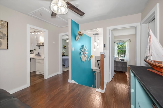 676 Ravensworth Dr, Conroe, TX 77302 - hall featuring dark wood finished floors, baseboards, and attic access