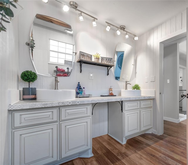 676 Ravensworth Dr, Conroe, TX 77302 - full bathroom with double vanity and wood finished floors
