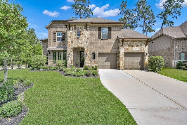 503 Woodsy Pine Ct, Conroe, TX 77304 - french country inspired facade featuring stone siding, concrete driveway, a front lawn, and brick siding