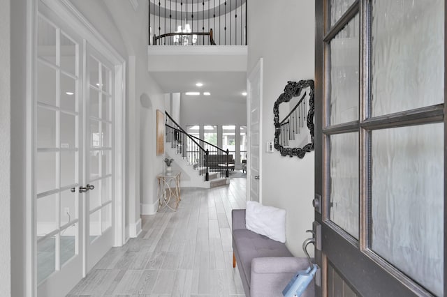 503 Woodsy Pine Ct, Conroe, TX 77304 - entryway featuring stairway, french doors, and a towering ceiling