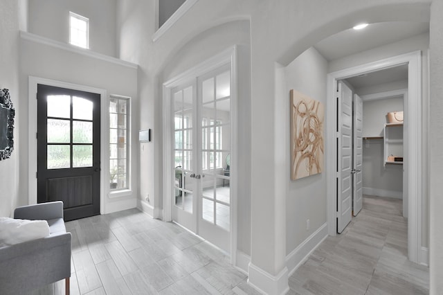 503 Woodsy Pine Ct, Conroe, TX 77304 - foyer featuring french doors, plenty of natural light, and baseboards