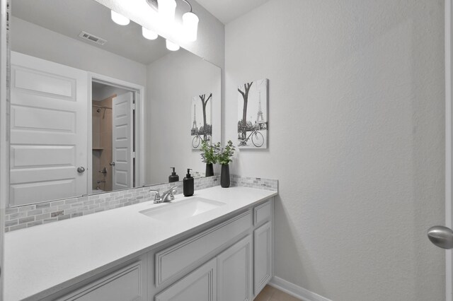503 Woodsy Pine Ct, Conroe, TX 77304 - bathroom featuring vanity, a shower, and baseboards