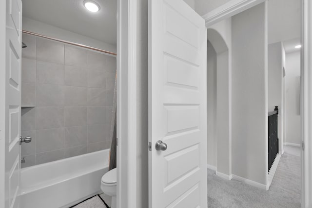 503 Woodsy Pine Ct, Conroe, TX 77304 - full bath featuring toilet, shower / washtub combination, and baseboards