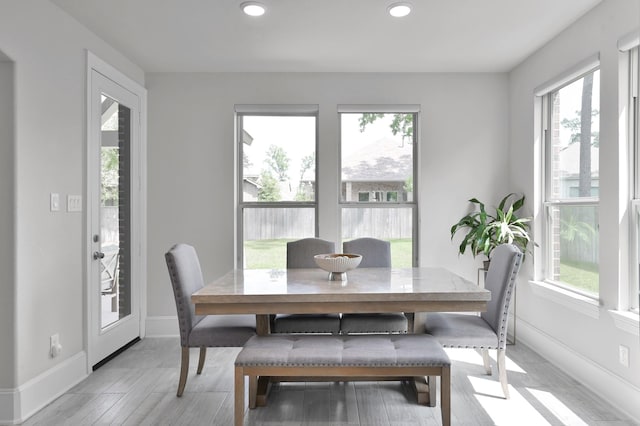 503 Woodsy Pine Ct, Conroe, TX 77304 - dining area with recessed lighting, light wood-style flooring, and baseboards