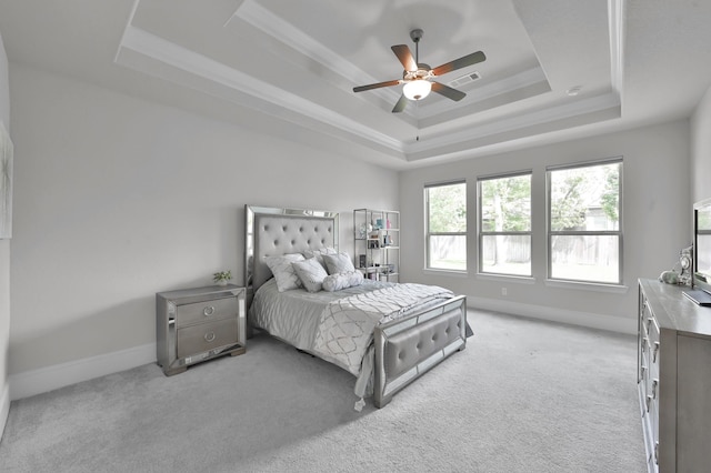 503 Woodsy Pine Ct, Conroe, TX 77304 - bedroom with a tray ceiling, light colored carpet, baseboards, a ceiling fan, and crown molding