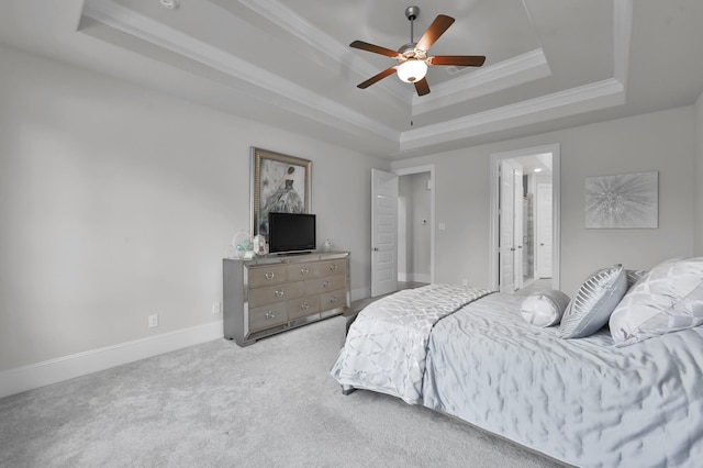 503 Woodsy Pine Ct, Conroe, TX 77304 - carpeted bedroom with a raised ceiling, ornamental molding, baseboards, a ceiling fan, and ensuite bathroom