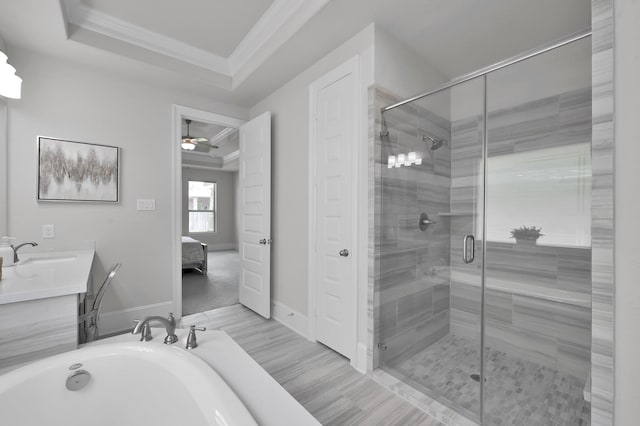 503 Woodsy Pine Ct, Conroe, TX 77304 - ensuite bathroom with ornamental molding, a shower stall, a tub, a ceiling fan, and vanity