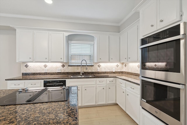 1438 Trace Dr, Houston, TX 77077 - kitchen featuring black appliances, a sink, white cabinetry, and crown molding