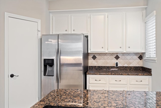 1438 Trace Dr, Houston, TX 77077 - kitchen with stainless steel refrigerator with ice dispenser, white cabinets, tasteful backsplash, and dark stone counters