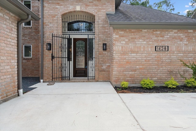 1438 Trace Dr, Houston, TX 77077 - doorway to property with brick siding and roof with shingles