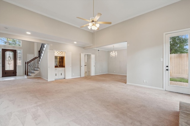 1438 Trace Dr, Houston, TX 77077 - unfurnished living room featuring light colored carpet, a chandelier, healthy amount of natural light, ornamental molding, and baseboards