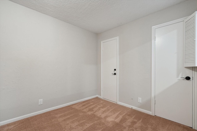 1438 Trace Dr, Houston, TX 77077 - spare room with light carpet, baseboards, and a textured ceiling