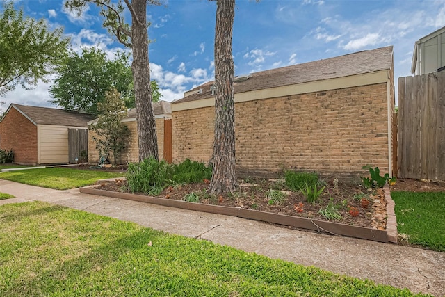 2023 Wilcrest Dr, Houston, TX 77042 - view of front facade with an outbuilding and brick siding