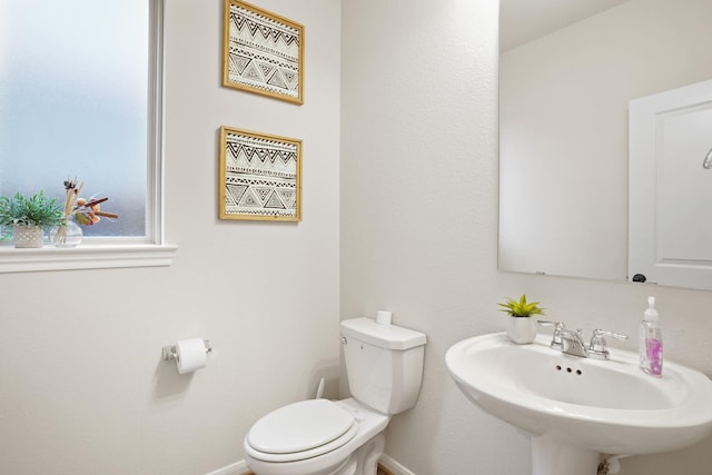 31110 Birch Mills Dr, Hockley, TX 77447 - bathroom featuring a sink, baseboards, and toilet
