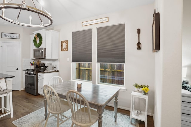31110 Birch Mills Dr, Hockley, TX 77447 - dining room with dark wood-style flooring and a chandelier